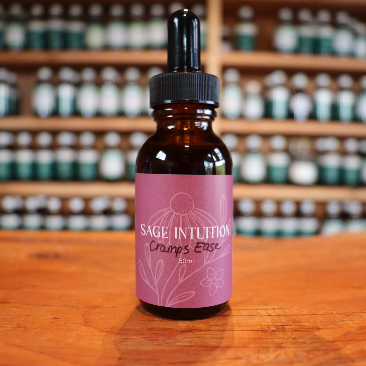 Bottle of after birth cramps tincture on a wooden surface with shelves in the background