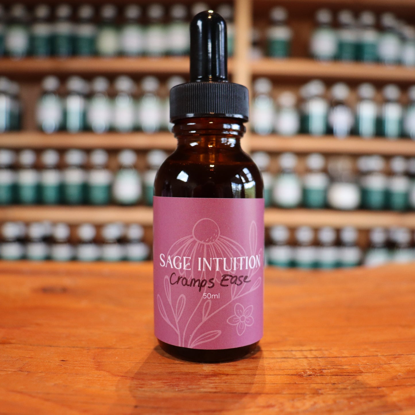Bottle of after birth cramps tincture on a wooden surface with shelves in the background
