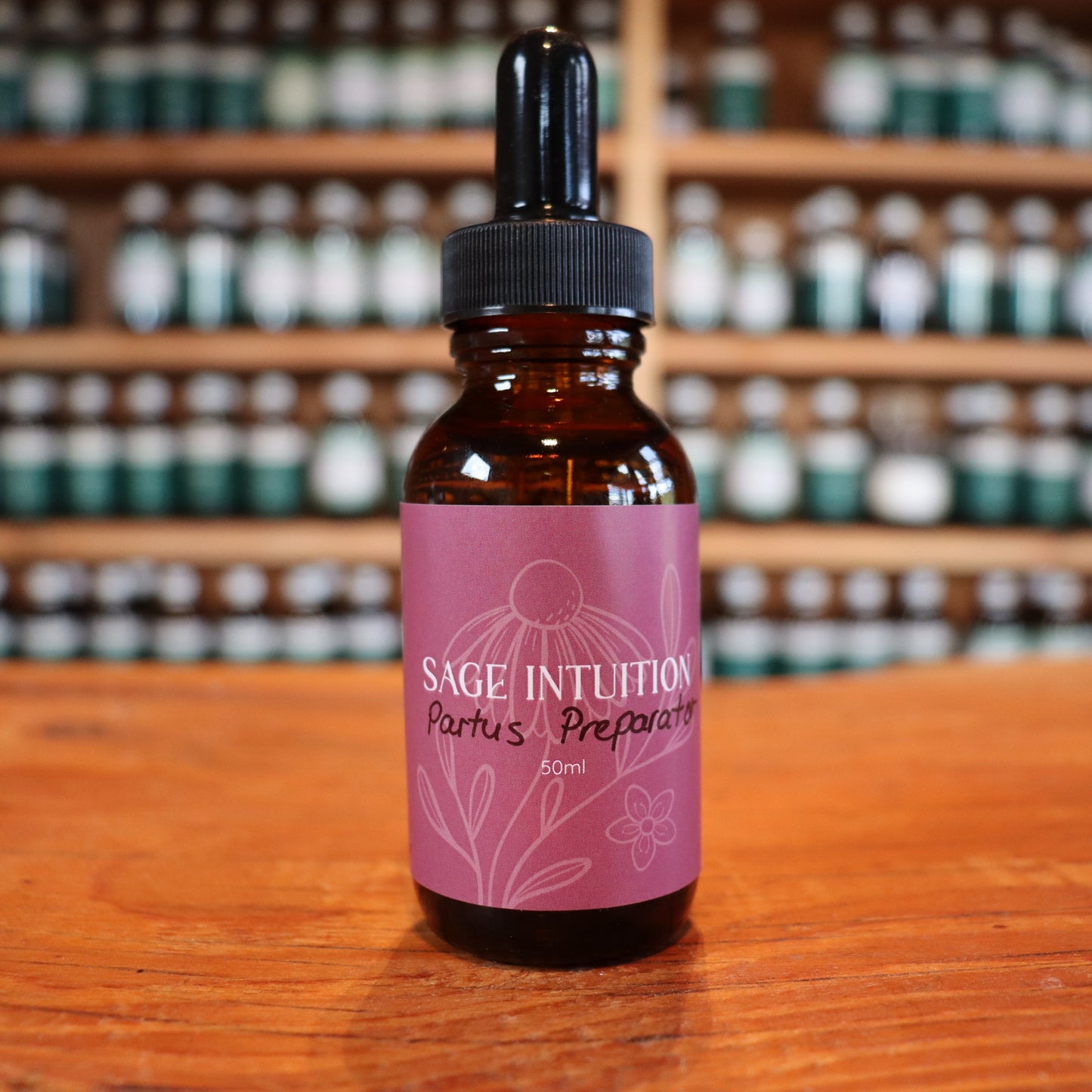 sage intuition bottle of tincture for preparing for birth paratus preparator on wooden shelves