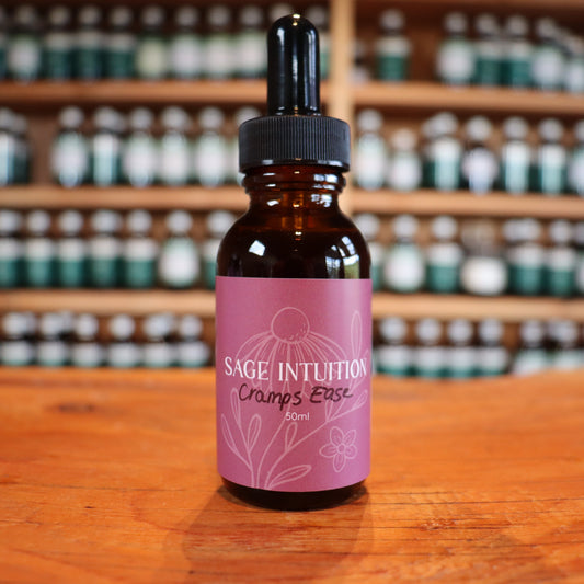 Bottle of after birth cramps tincture on a wooden surface with shelves in the background